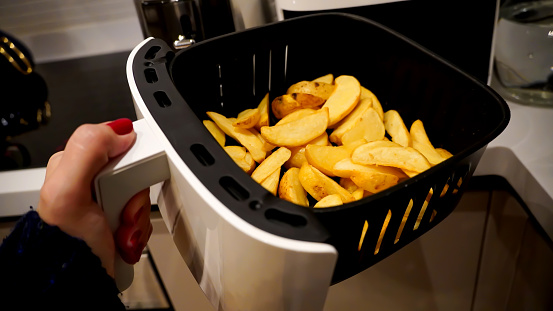 Apple sliced french fries are fried in the airfryer without oil for diet