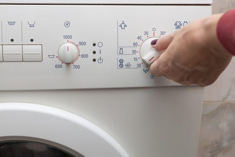 a person chooses a washing mode with a switch. washing mode. temperature mode.